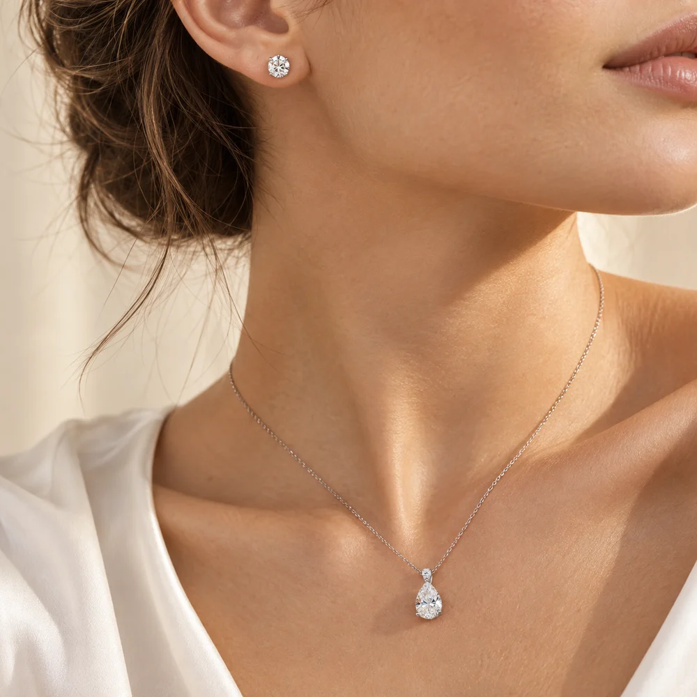 Diamond stud and pendant styled together