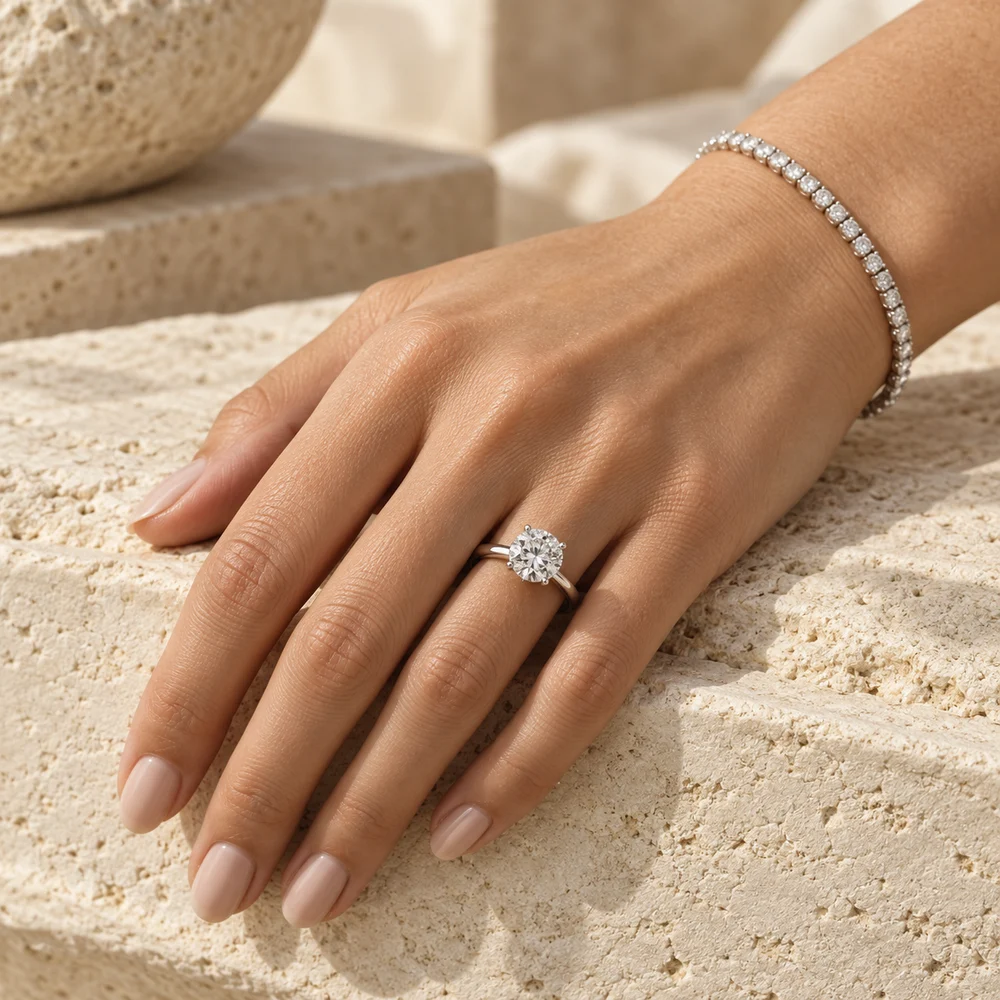 Solitaire ring worn on a hand